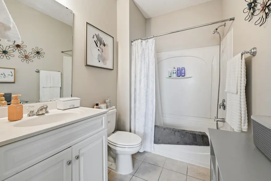 Second full bathroom with tub and shower