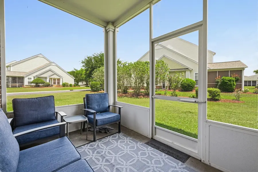 Screened porch overlooking maintained green space