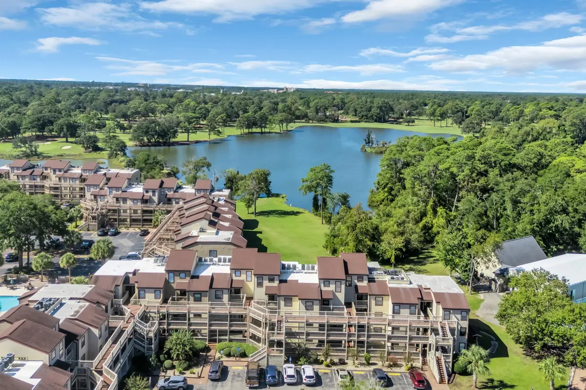 Aerial view of the Dunes Pointe buildings beside the lake