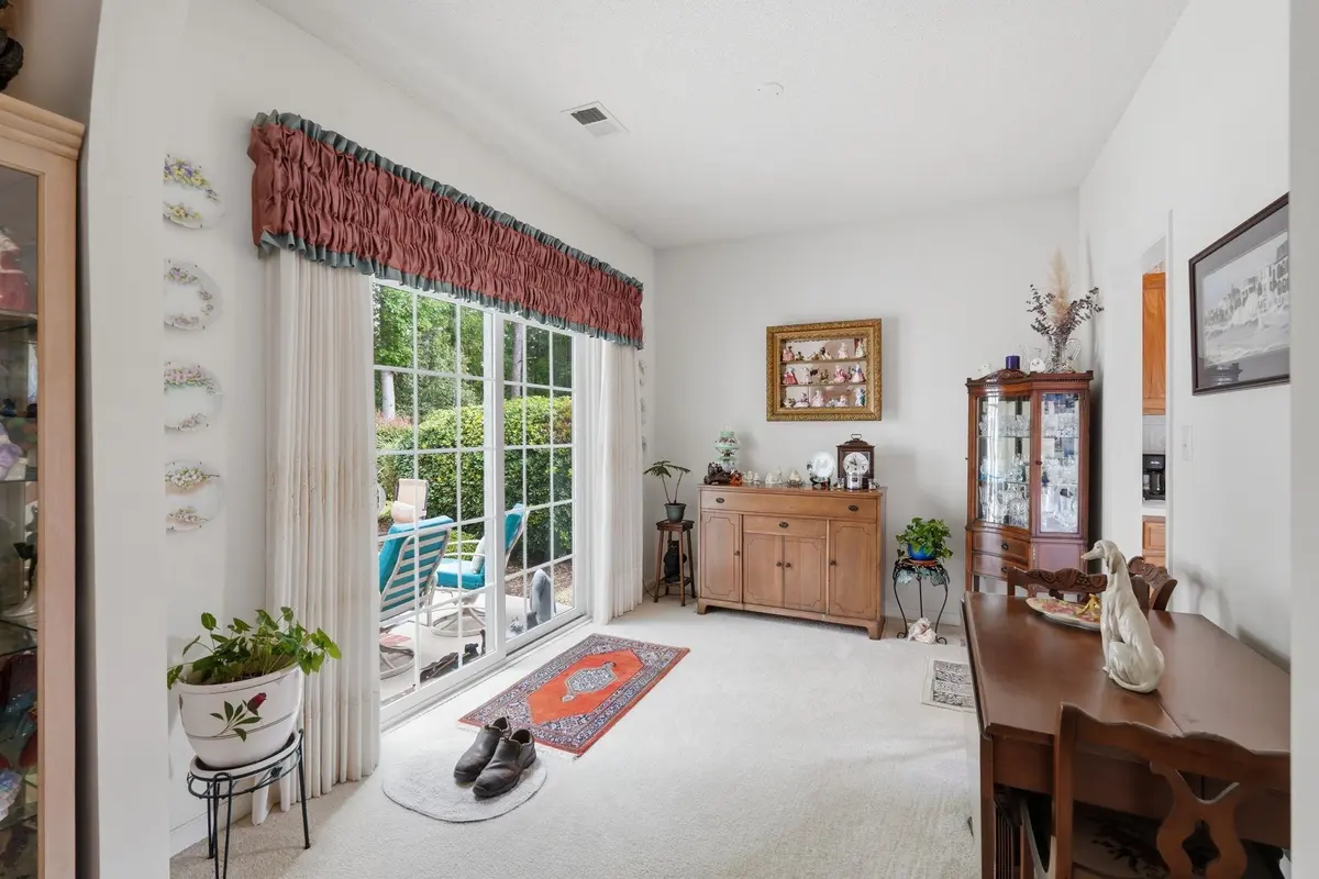 Formal dining room with sliding glass door to the patio