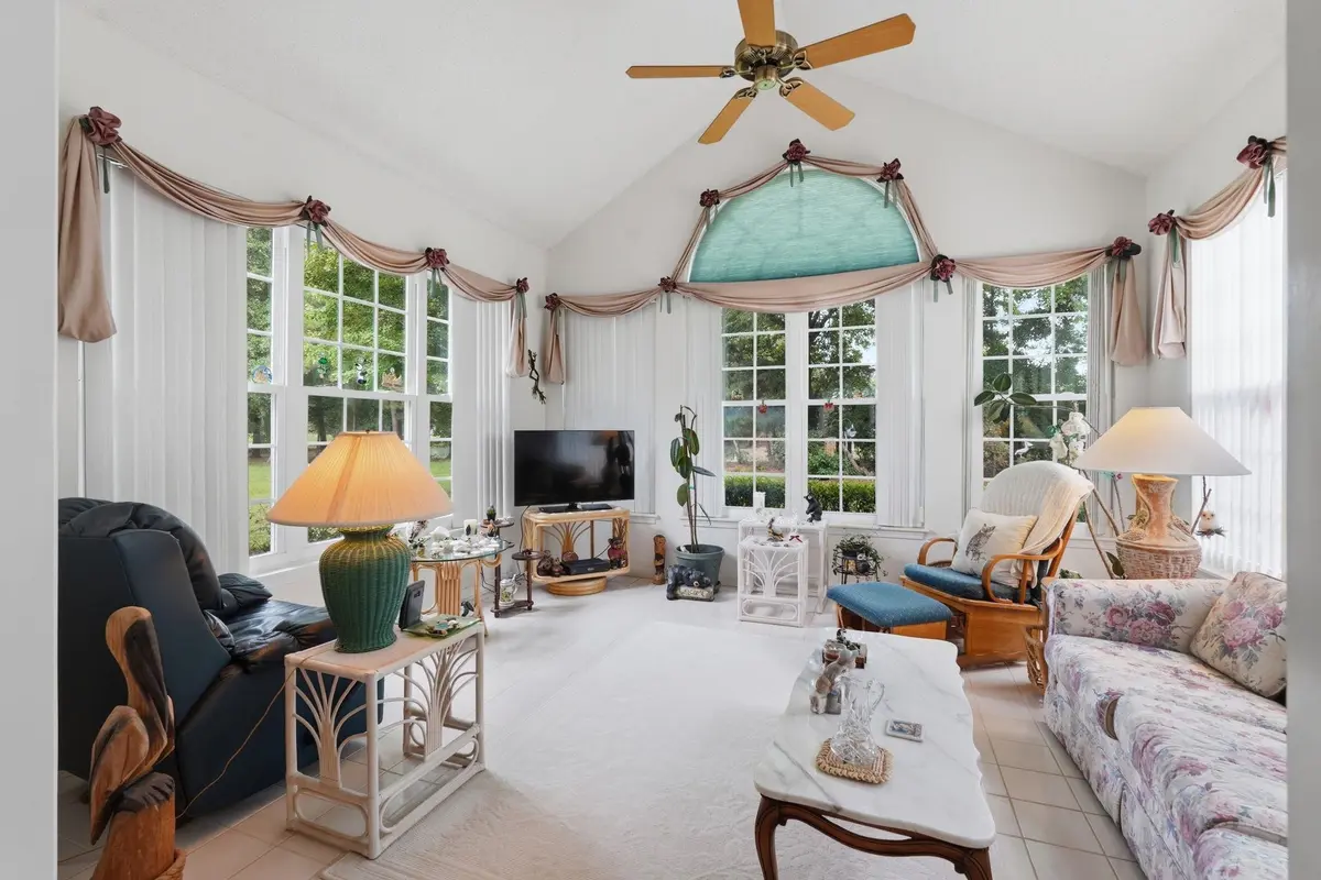 Carolina room with multiple windows overlooking the yard
