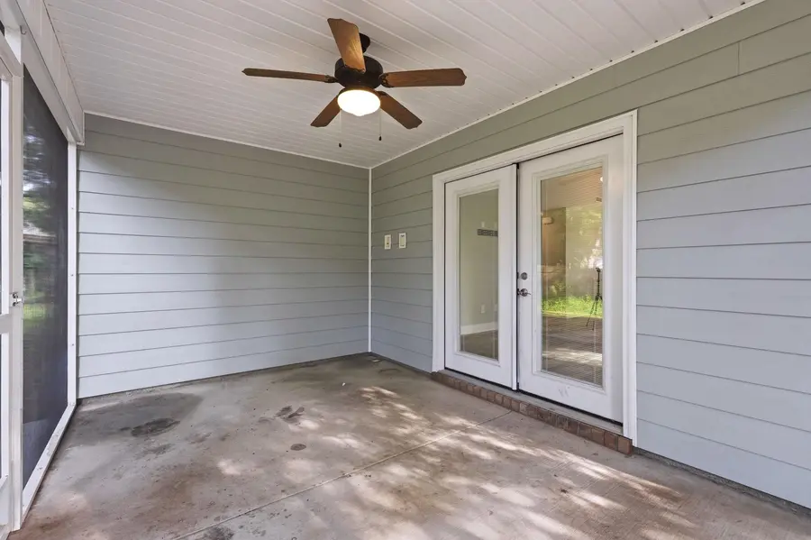 Covered screened porch with ceiling fan