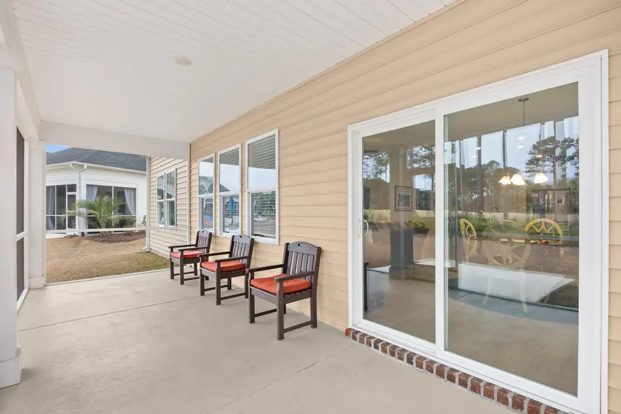 Screened rear porch overlooking the golf course